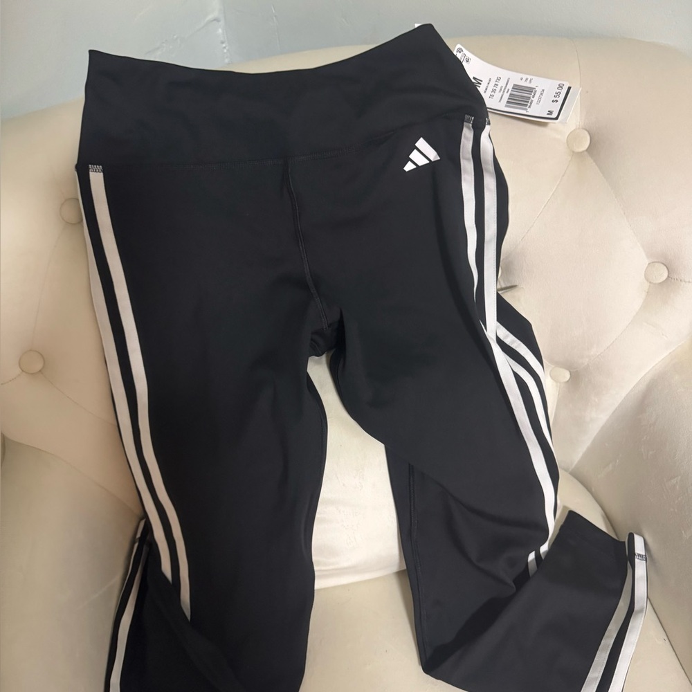 Adidas training pants with White Stripes